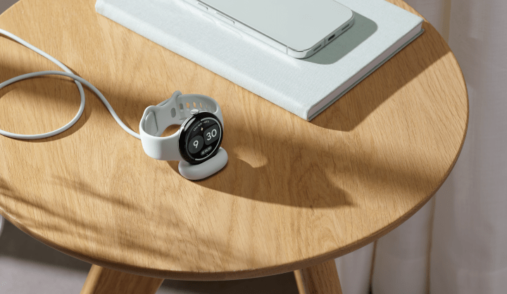 Google Pixel Watch 5 on display with health monitoring features shown on screen