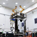 Northrop Grumman MRV robotic satellite in orbit above Earth with arms extended